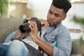 male photographer checking dslr camera Royalty Free Stock Photo