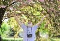 Male photographer enjoy cherry blossom. travel and walking in cherry blossom park. hobby at retirement. tourism and
