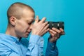 Male photographer examining his new camera Royalty Free Stock Photo