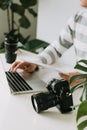 Male photographer holding digital camera above the desk in his photo studio Royalty Free Stock Photo