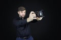 Male photographer looks at digital camera display
