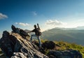 Male photographer Rock climbing mountain top