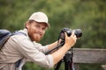 male photographer using tripod for landscape photography Royalty Free Stock Photo