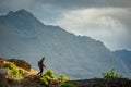 Male photographer walking on Queenstown hill Royalty Free Stock Photo