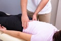 Physiotherapist Doing Female`s Back Massage In Clinic Royalty Free Stock Photo