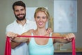 Male physiotherapist giving shoulder massage to female patient Royalty Free Stock Photo