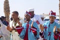 Male pilgrims clap hands