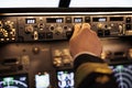 Male pilot pushing buttons to fix altitude level on control panel command Royalty Free Stock Photo