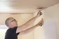 Male Plasterer Plastering Ceiling In Room Of House Royalty Free Stock Photo