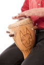 Male playing African drum on his lap Royalty Free Stock Photo