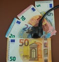 A male plug on banknotes (EUR)