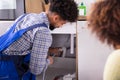 Male Plumber Cleaning Clogged Pipes Royalty Free Stock Photo