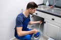 Plumber Cleaning Clogged Sink Pipe Royalty Free Stock Photo