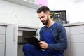 Male plumber with clipboard. Repair service Royalty Free Stock Photo