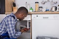 Male Plumber Fixing Sink Pipe Royalty Free Stock Photo