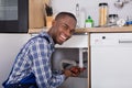 Male Plumber Fixing Sink Pipe Royalty Free Stock Photo