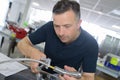 Male plumber fixing sink pipe Royalty Free Stock Photo