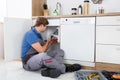 Male Plumber Fixing Sink Pipe Royalty Free Stock Photo