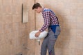 Male Plumber Installing Sink In Bathroom Royalty Free Stock Photo