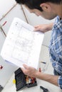 male plumber looking at plans Royalty Free Stock Photo