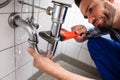 Plumber Repairing Sink Pipe Leakage Royalty Free Stock Photo