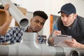male plumber teaching male apprentice Royalty Free Stock Photo