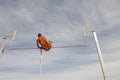 Male Pole Vaulter Clearing Bar