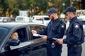 Male police officers checking the driving license Royalty Free Stock Photo