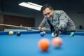 the male pool player positioning the white ball Royalty Free Stock Photo