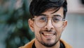 Male portrait headshot young handsome happy indian guy looking at camera smiling toothy smile successful confident Royalty Free Stock Photo