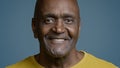 Male portrait mature african american man looking camera smiling with white toothy smile joyful ethnic senior male Royalty Free Stock Photo