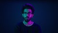 Male portrait neon background shocked amazed astonish wonder Indian man coder hacker computer technology worker guy