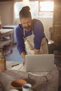 Male potter working on laptop Royalty Free Stock Photo