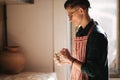 Male potter works with clay. Hand`s of man creating ceramic product