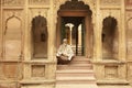 Male priest sitting near the ancient temple in Vrindavan India