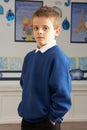 Male Primary School Pupil Standing In Classroom Royalty Free Stock Photo