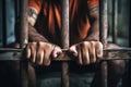 The male prisoner grabbed the prison bars with his hands. The pain and suffering of the prisoner. The inevitability of a judicial Royalty Free Stock Photo