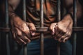The male prisoner grabbed the prison bars with his hands. The pain and suffering of the prisoner. The inevitability of a judicial Royalty Free Stock Photo