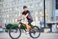 Male cyclist training on bike after hard working day Royalty Free Stock Photo