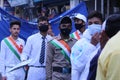 Male protesters wearing protective face masks in India's Uttarakhand region