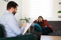 A male pshycologist and a female patient in a therapy session Royalty Free Stock Photo