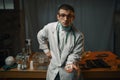 Male psychiatrist in lab coat shows sedative pills