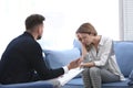 Male psychologist with client