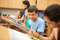 Male Pupil In High School Art Class