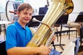 Male Pupil Playing Tuba In High School Orchestra Royalty Free Stock Photo