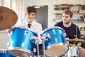 Male Pupil With Teacher Playing Drums In Music Lesson Royalty Free Stock Photo