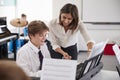 Male Pupil With Teacher Playing Piano In Music Lesson Royalty Free Stock Photo