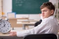 Male pupil in time management concept Royalty Free Stock Photo