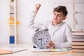 Male pupil in time management concept Royalty Free Stock Photo