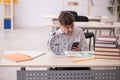 Male pupil in time management concept Royalty Free Stock Photo